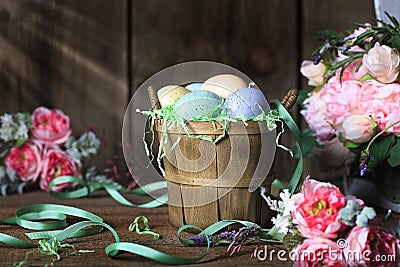 Rustic Basket of Easter Eggs Stock Photo