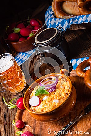 Rustic Bavarian obazda with radishes and onions Stock Photo