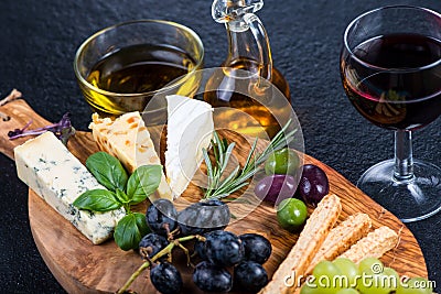 Rustic board with cheese selection,tapas style appetizer Stock Photo