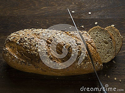 Rustic bread slicing Stock Photo