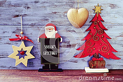 Rustic christmas ornaments and text seasons greetings Stock Photo