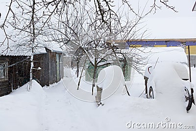 Rustic courtyard in the snow Stock Photo
