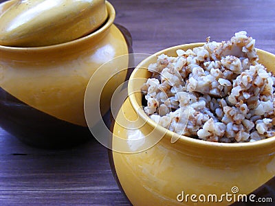 Traditional rustic cuisine of Belarus, Ukrain and Russia : Boiled buckwheat in a ceramic bowl close up view Stock Photo