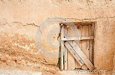 Rustic door and adobe wall Stock Photo