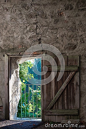 Rustic door in the wall Stock Photo