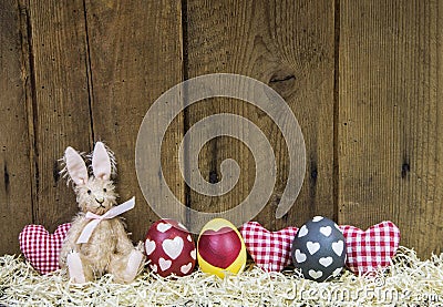 Rustic easter wooden background for a greeting card with eggs. Stock Photo