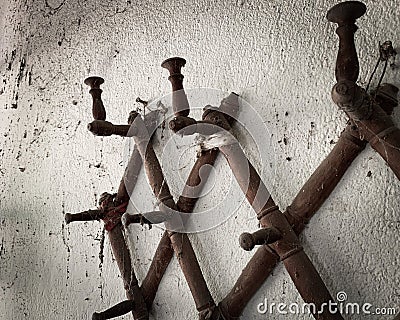 Rustic empty wall hooks. Antique farmhouse wall hangers. Stock Photo