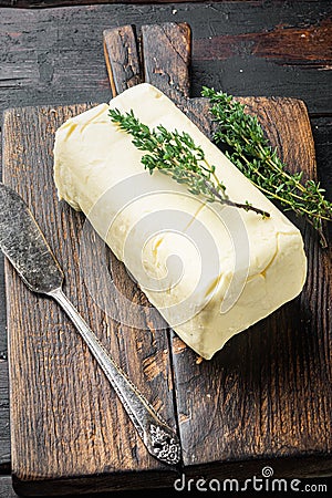 Rustic farmhouse inspired butter, on old dark wooden table background Stock Photo
