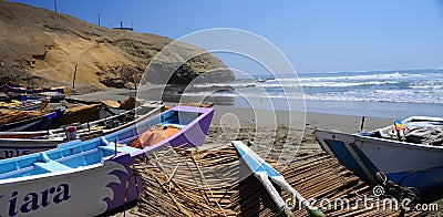 Rustic fishing boast in the coast of Lima Peru } Stock Photo