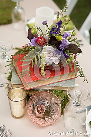 Rustic Floral Centerpiece with books Stock Photo