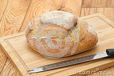 Rustic French bread on a cutting board Stock Photo