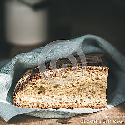 Rustic French rye bread loaf on wooden board, square crop Stock Photo