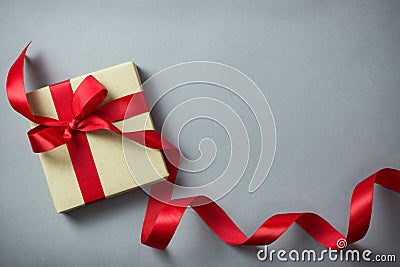 Rustic gift box with red ribbon Stock Photo