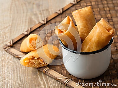 Rustic golden chinese spring rolls Stock Photo