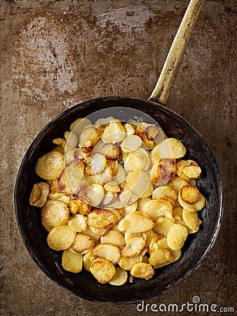 Rustic golden german pan fried potato bratkartofflen Stock Photo