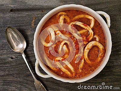 Rustic italian calamari seafood soup Stock Photo