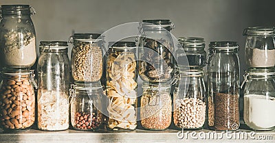 Rustic kitchen food storage arrangement in glass jars Stock Photo