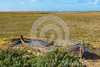 Rustic old boat left to decay on Salt Marshes between Blakeney and Cley Stock Photo