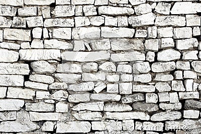 Rustic old wall with white bricks, different sizes Stock Photo