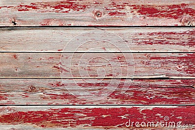 Rustic old weathered wood plank background with flaking red paint Stock Photo