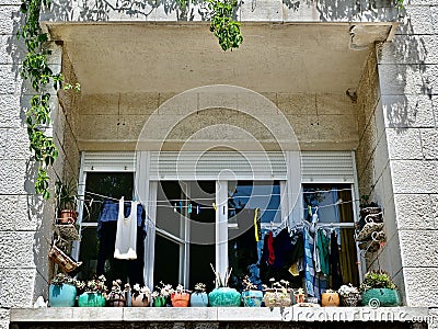 Old World Apartment Balcony With Hanging Laundry Stock Photo