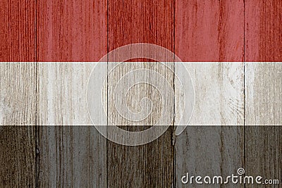 A rustic old Yemen flag on weathered wood Stock Photo