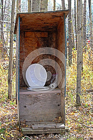 A rustic outhouse at a hunting camp Stock Photo