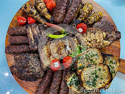 Rustic platter prepared for tourists with small, pork ribs with toast spread with lard Stock Photo