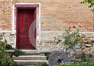 Rustic Red Door Brick Stone Building Stock Photo