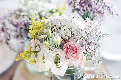 Rustic romantic pastel flower arrangement decoration on wedding Stock Photo