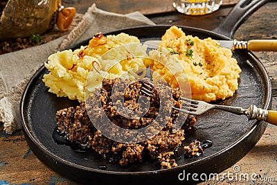 Rustic serving of haggis, neeps and tatties Stock Photo