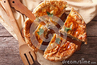 Rustic sliced chicken pie close-up on the table. horizontal top Stock Photo