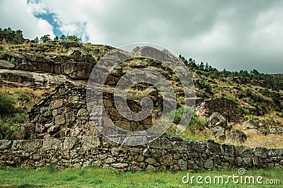 Rustic stone house on a hilly landscape Stock Photo