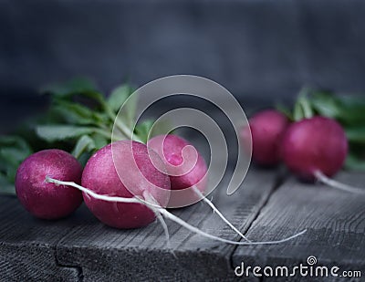 Rustic style. Fresh Radishes on the wooden table. Stock Photo