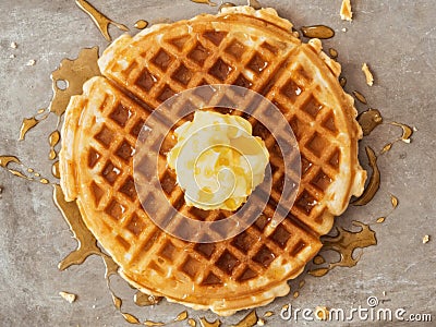 Rustic traditional waffle with butter and maple syrup Stock Photo