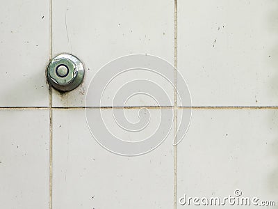 Rustic water shower knob on old wall Stock Photo