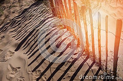 Rustic and weathered fence in front of sand dune on sandy sea beach Crosby England Europe. Stock Photo