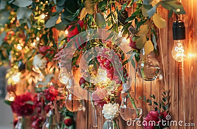 Rustic wedding photo zone. Hand made wedding decorations includes Photo Booth red flowers. Stock Photo