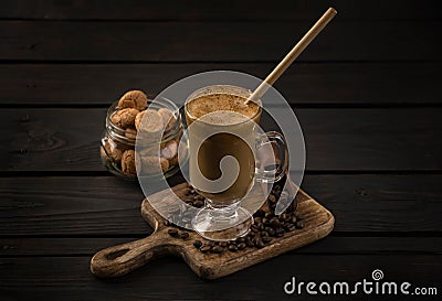 glass of whipped dalgona coffee with cookies Stock Photo