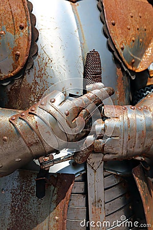 Rusty armor and medieval sword of a soldier of Kings Stock Photo