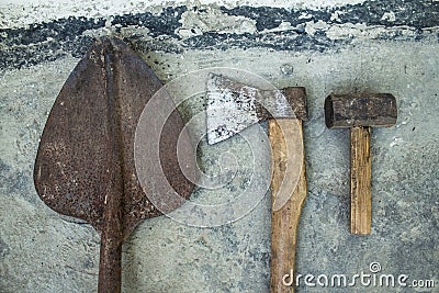 Rusty ax hammer and shovel on a white background Stock Photo