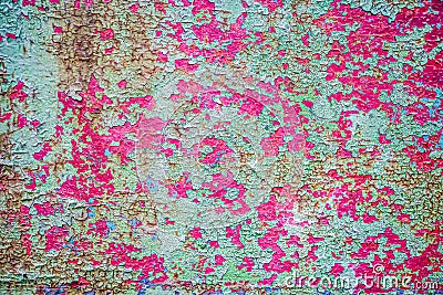 Rusty background. A rusty old metal plate with cracked green and pink gloss paint Stock Photo