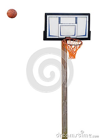 Rusty basketball hoop with ball in midair Stock Photo