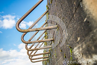 Rusty bent iron bars of an old bunker from close Stock Photo