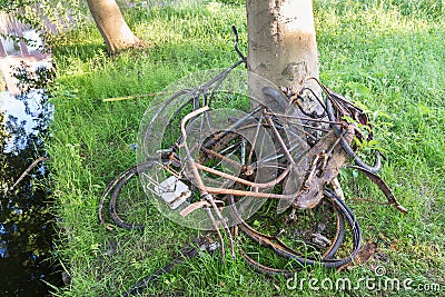 Rusty bicycles that have been lifted from a ditch Stock Photo