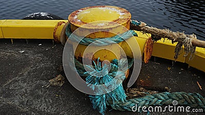 a rusty bollard with ship's ropes, Heimaey, Iceland Stock Photo