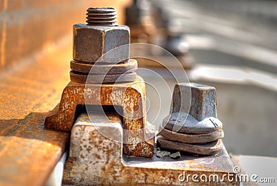 Rusty bolt from trolley track Stock Photo