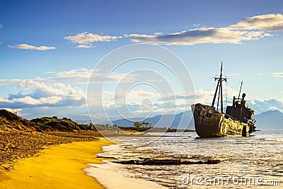 Rusty broken shipwreck on sea shore Stock Photo