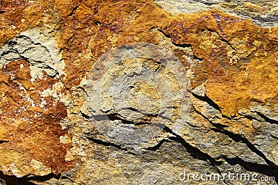 Rusty brown stone surface texture with cracks. Sea limestone. Stock Photo