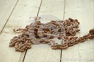 Rusty Chain on Wooden Deck Stock Photo